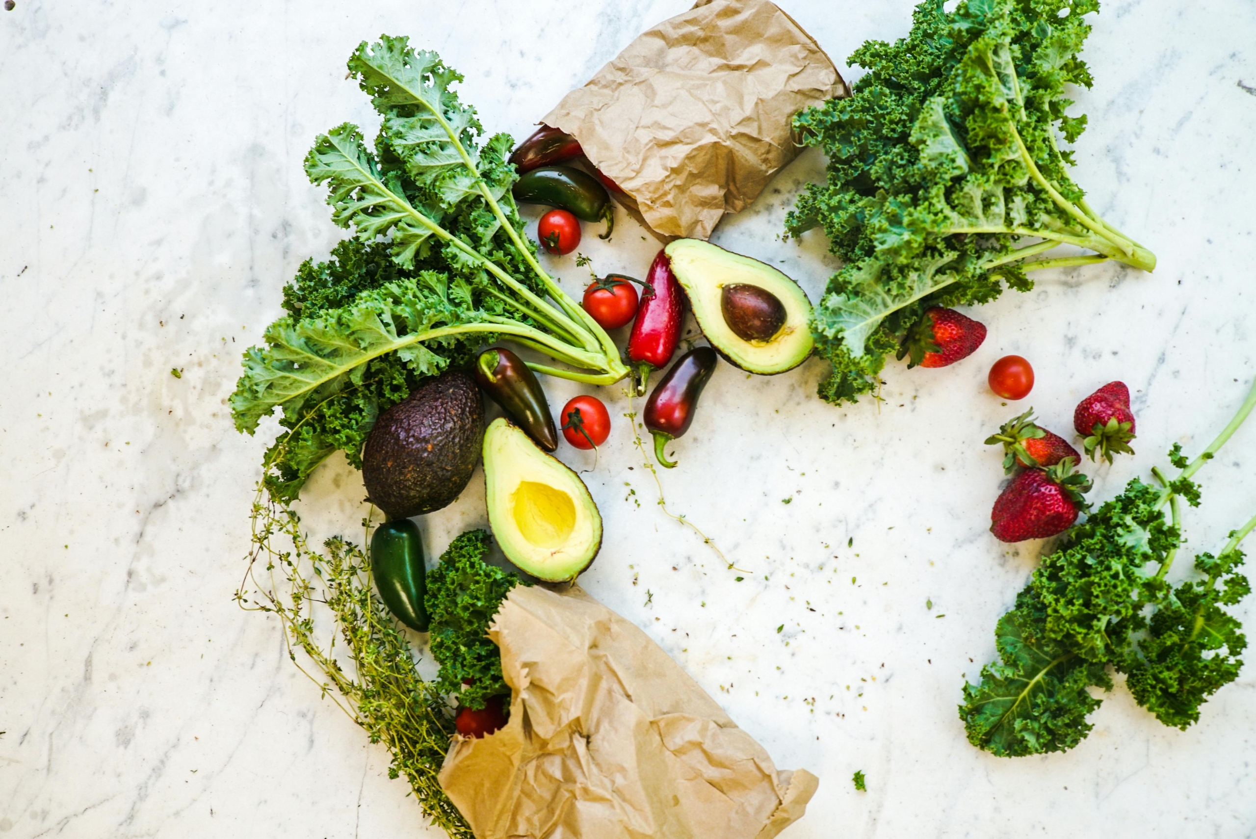 A photo of avocoado, kale, cherries for clean eating