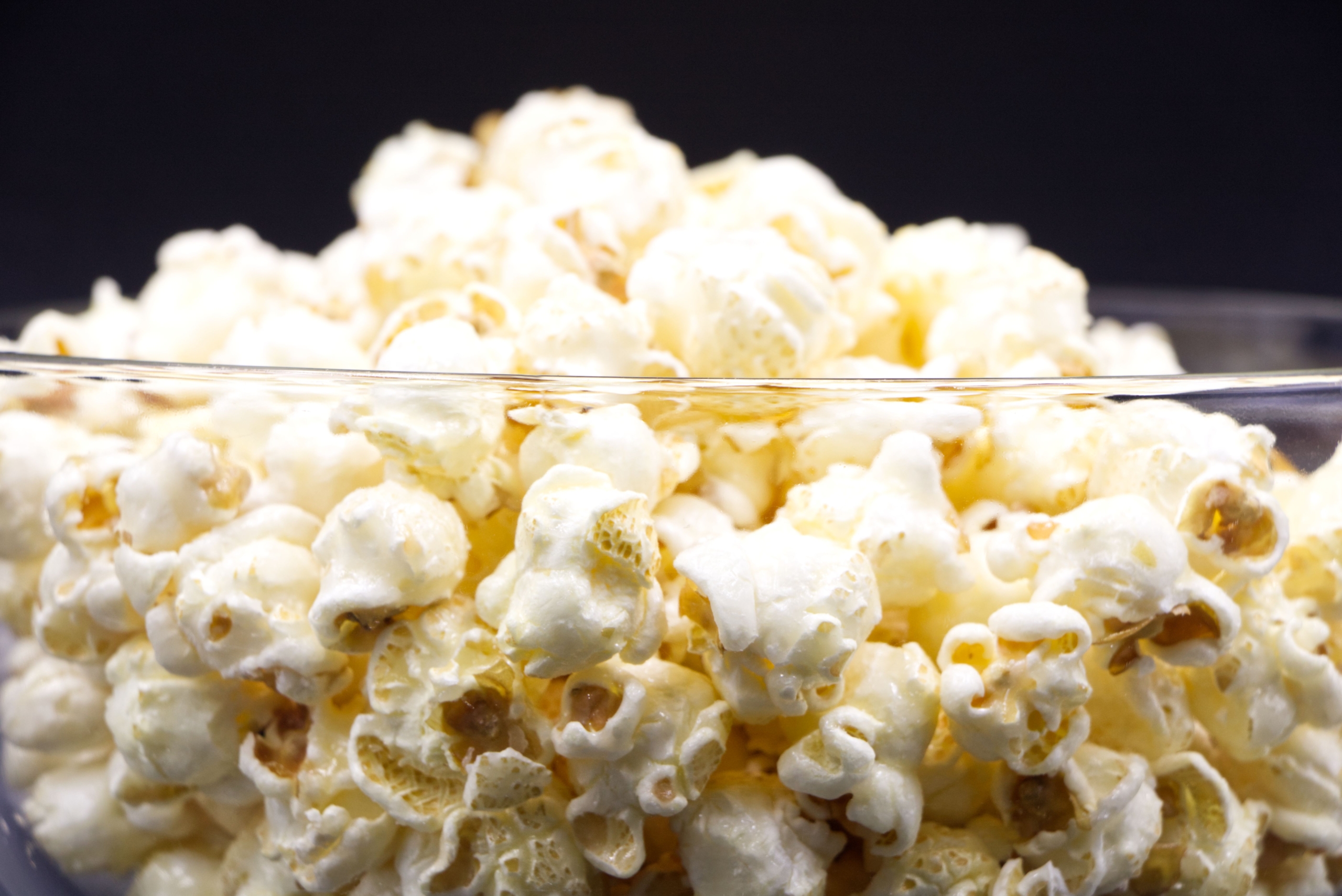 Microwave popcorn bag and plain popcorn illustrating the difference between processed and simple food choices